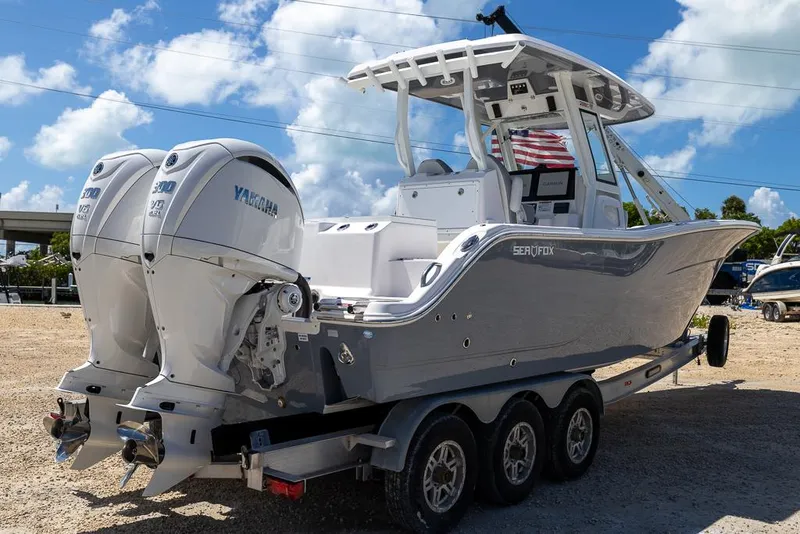 Slide: The Image of 2026 Sea Fox 288 Commander boat with twin Yamaha engines on a trailer. - 4