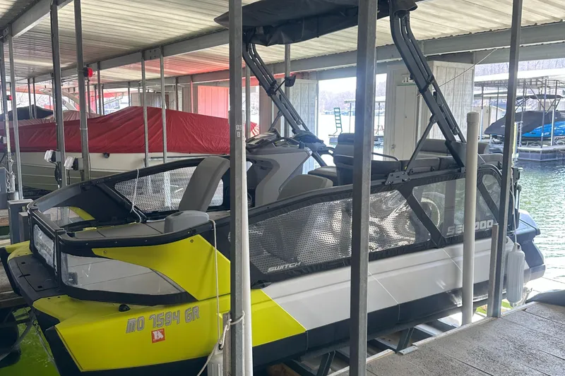 The Image of 2022 Sea-Doo Switch Cruise 18 docked in a covered marina. - 0