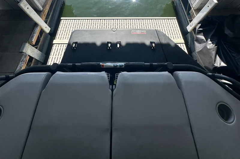 Slide: The Image of 2022 Sea-Doo Switch Cruise 18 docked, rear view showing seating and platform. - 10