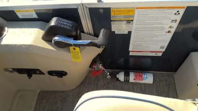Slide: The Image of 2025 Godfrey Pontoons Sweetwater 2086 SB control panel with safety instructions and fire extinguisher. - 11