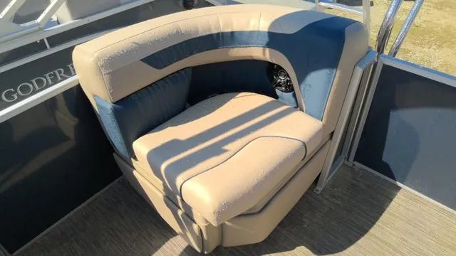 Slide: The Image of Luxurious seating on 2025 Godfrey Pontoons Sweetwater 2086 SB, featuring beige and blue upholstery. - 13