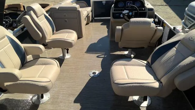 Slide: The Image of 2025 Godfrey Pontoons Sweetwater 2086 SB interior with beige seating and steering console. - 14