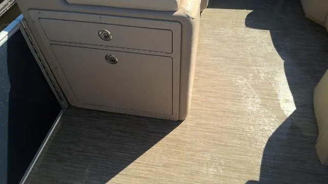 Slide: The Image of 2025 Godfrey Pontoons Sweetwater 2086 SB interior with beige cabinetry and flooring. - 16