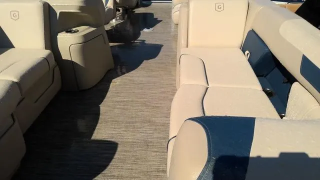 Slide: The Image of Interior of 2025 Godfrey Sweetwater 2086 SB pontoon with beige and blue seating. - 3