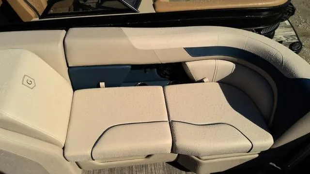 Slide: The Image of 2025 Godfrey Pontoons Sweetwater 2086 SB seating, beige upholstery, curved design, outdoor setting. - 5