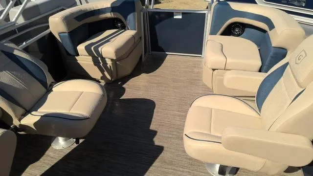 Slide: The Image of Interior of 2025 Godfrey Sweetwater 2086 SB pontoon with beige and blue seating. - 7