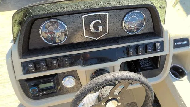 Slide: The Image of 2025 Godfrey Pontoons Sweetwater 2086 SB dashboard with controls and steering wheel. - 8