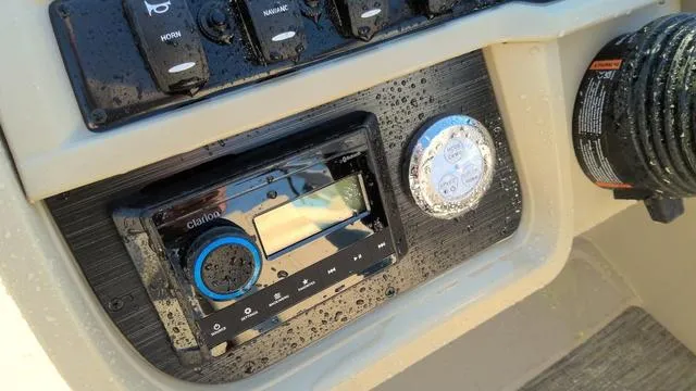 Slide: The Image of Control panel of 2025 Godfrey Pontoons Sweetwater 2086 SB with audio system and controls. - 9