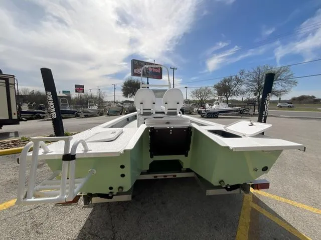 Slide: The Image of 2025 Majek 2206 Illusion boat, rear view, parked outdoors under a clear sky. - 3