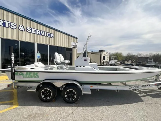 Slide: The Image of 2025 Majek 2206 Illusion boat on trailer outside service center. - 6