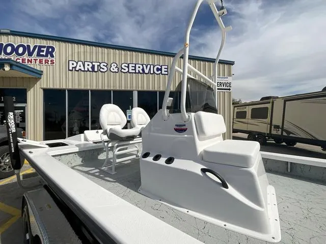 Slide: The Image of 2025 Majek 2206 Illusion boat at service center, featuring sleek white design and dual seating. - 8