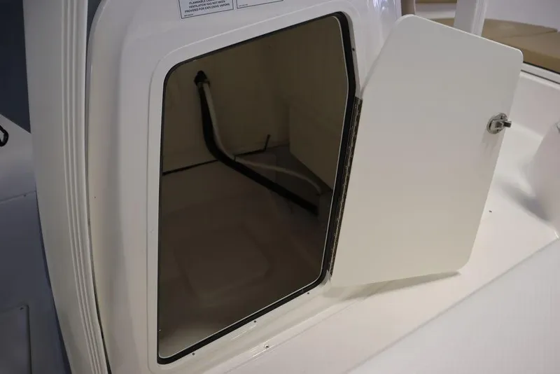 Slide: The Image of Open storage compartment on 2025 Bayliner 22 CC Trophy boat. - 13