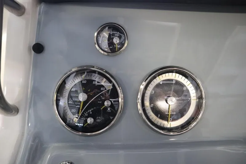 Slide: The Image of Dashboard gauges of 2025 Bayliner 22 CC Trophy boat. - 17