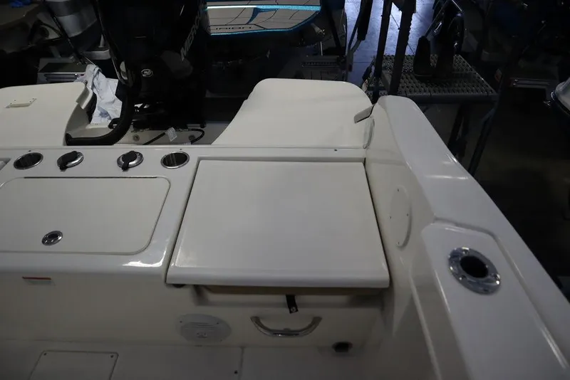 Slide: The Image of 2025 Bayliner 22 CC Trophy boat interior with storage compartments and seating. - 26