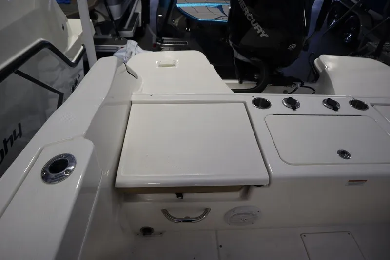 Slide: The Image of 2025 Bayliner 22 CC Trophy boat interior with seating and control panel. - 28
