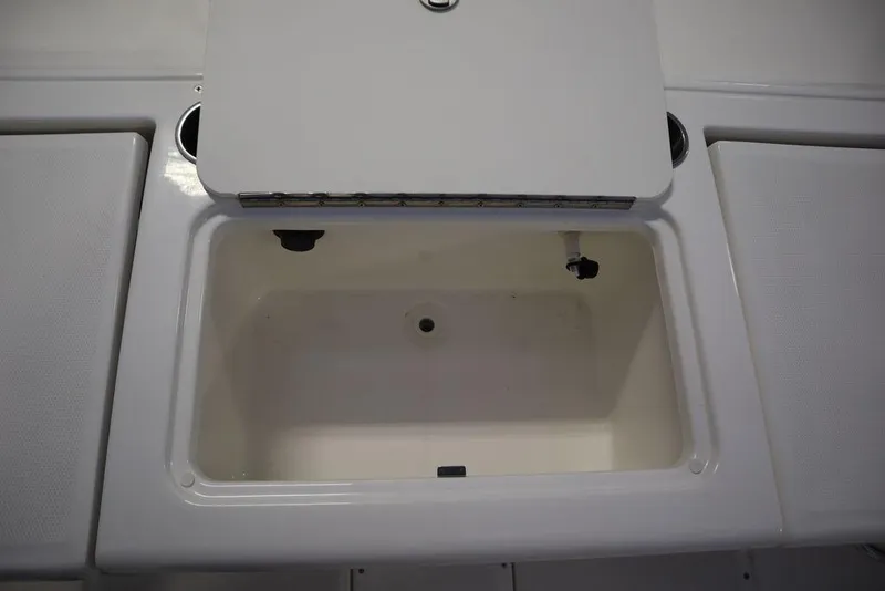 Slide: The Image of Open storage compartment on 2025 Bayliner 22 CC Trophy boat. - 30