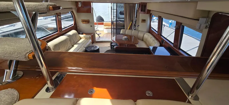 Slide: The Image of Luxurious interior of 2005 Carver 560 Voyager yacht with elegant seating and wood finishes. - 17