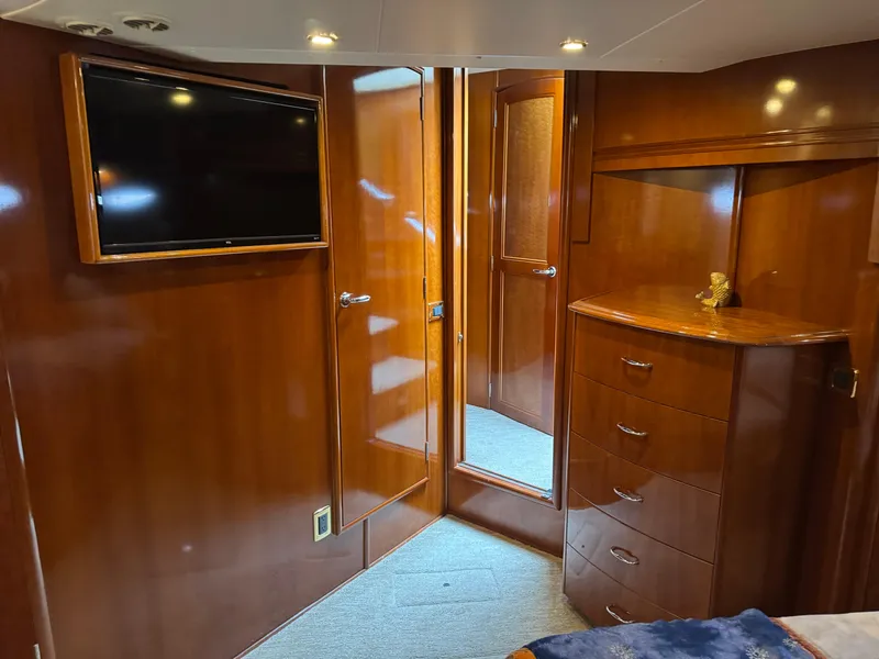 Slide: The Image of Luxurious interior of 2005 Carver 560 Voyager yacht with wood paneling and modern amenities. - 27
