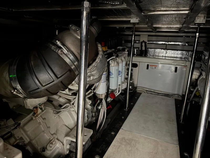 Slide: The Image of Engine room of a 2005 Carver 560 Voyager yacht, showcasing mechanical components. - 39