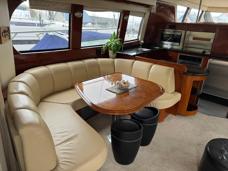 Slide: The Image of Luxurious interior of 2005 Carver 560 Voyager yacht with leather seating and modern kitchen. - 10
