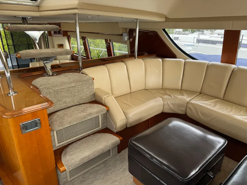 Slide: The Image of Luxurious interior of 2005 Carver 560 Voyager yacht with beige leather seating. - 15