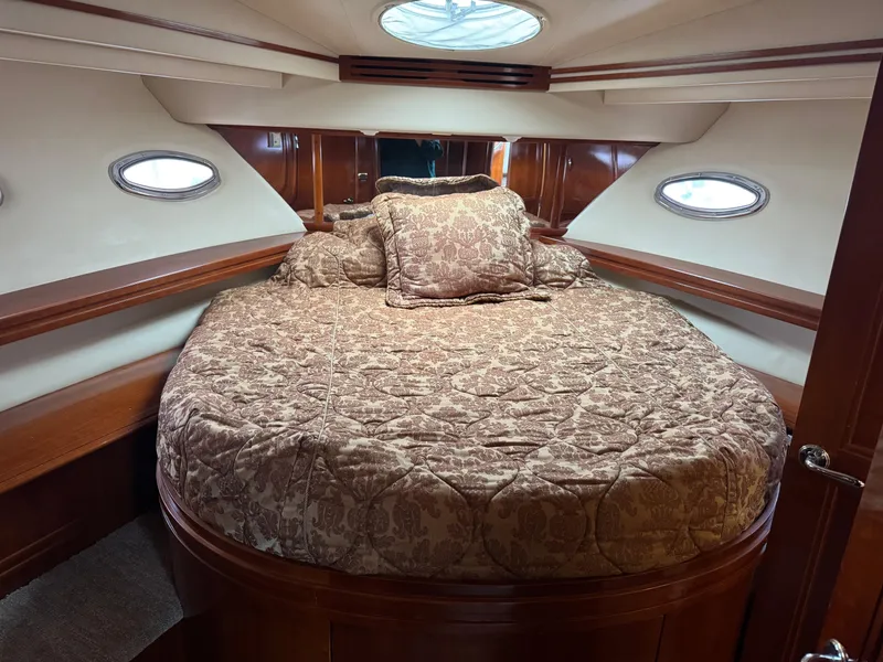 Slide: The Image of Luxurious cabin interior of 2005 Carver 560 Voyager yacht with elegant bedding. - 29