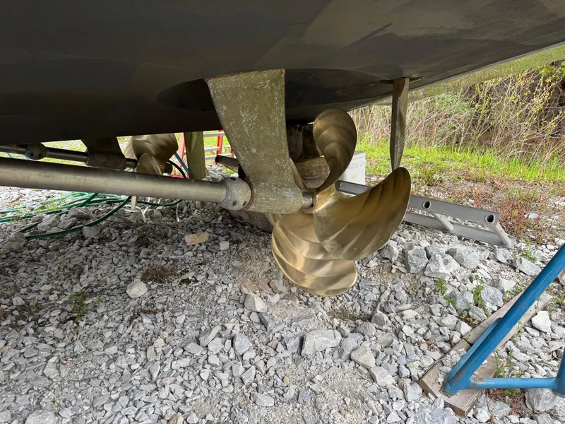 Slide: The Image of Propeller of 2005 Carver 560 Voyager yacht on rocky ground. - 3