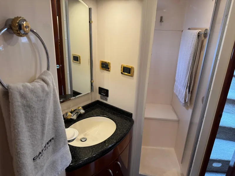 Slide: The Image of Luxurious bathroom in 2005 Carver 560 Voyager yacht with sink, mirror, and shower. - 30