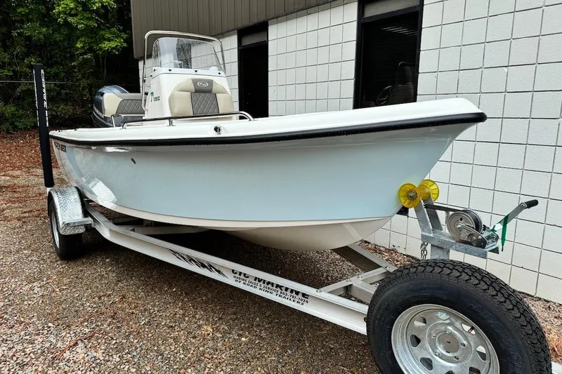 The Image of 2025 Key West 1720 Center Console boat on trailer, parked outdoors. - 0