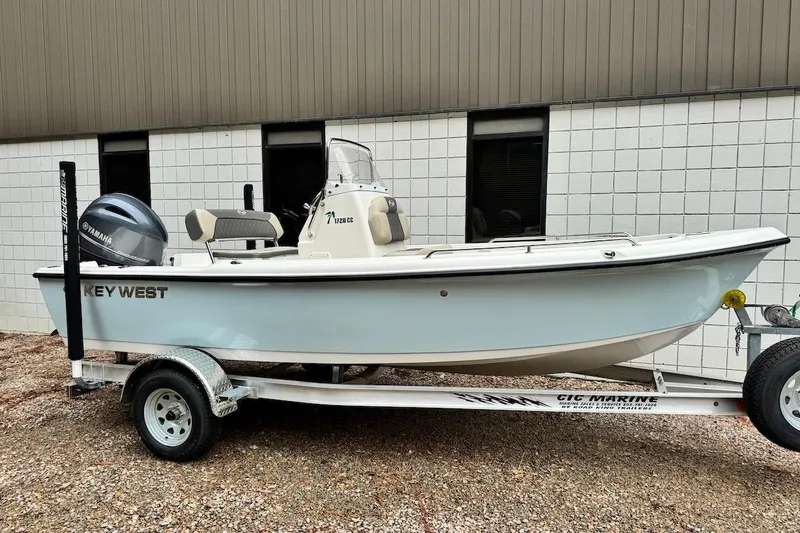 Slide: The Image of 2025 Key West 1720 Center Console boat on trailer, parked outdoors. - 1