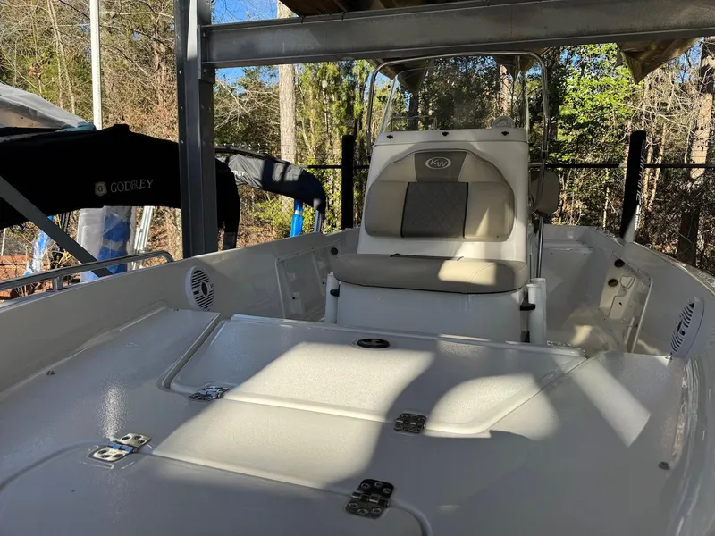 Slide: The Image of 2025 Key West 1720 Center Console boat in a covered dock, featuring a sleek design. - 9