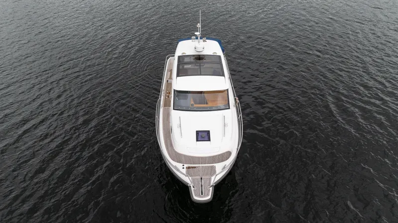 Slide: The Image of Aerial view of a 2017 Nimbus 365 Coupe boat on calm water. - 10