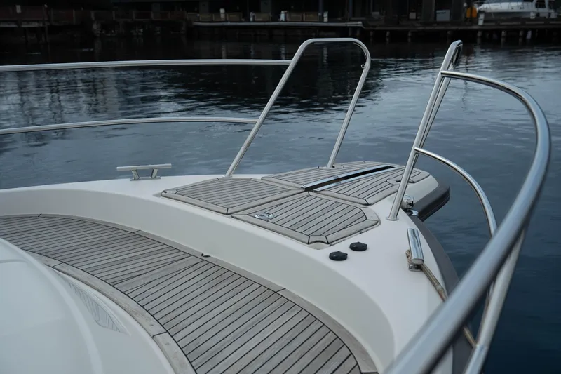 Slide: The Image of Bow of 2017 Nimbus 365 Coupe yacht with wooden deck and railing. - 12