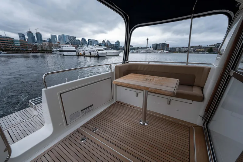 Slide: The Image of 2017 Nimbus 365 Coupe boat interior with city skyline view. - 17