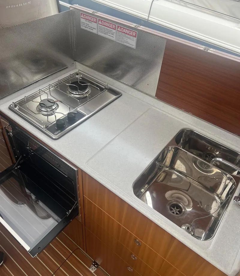 Slide: The Image of 2017 Nimbus 365 Coupe kitchen with stove, oven, and sink. - 30