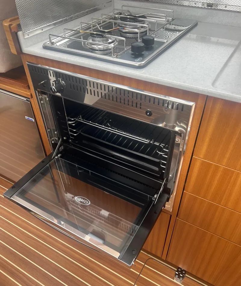 Slide: The Image of Modern kitchen in 2017 Nimbus 365 Coupe with open oven and gas stove. - 31