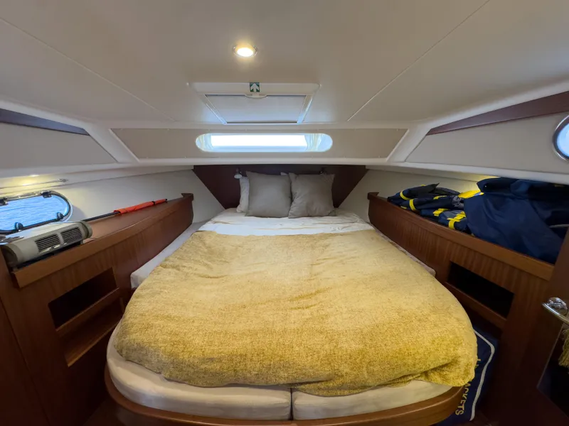 Slide: The Image of Cozy cabin interior of 2017 Nimbus 365 Coupe with a comfortable bed and wooden accents. - 37