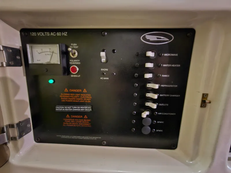 Slide: The Image of Electrical control panel of a 2003 Chaparral 260 Signature Cruiser boat. - 11