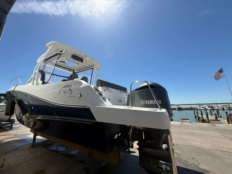 Slide: The Image of 2020 Jeanneau Leader 9.0 WA boat with Yamaha engine at marina under clear sky. - 19
