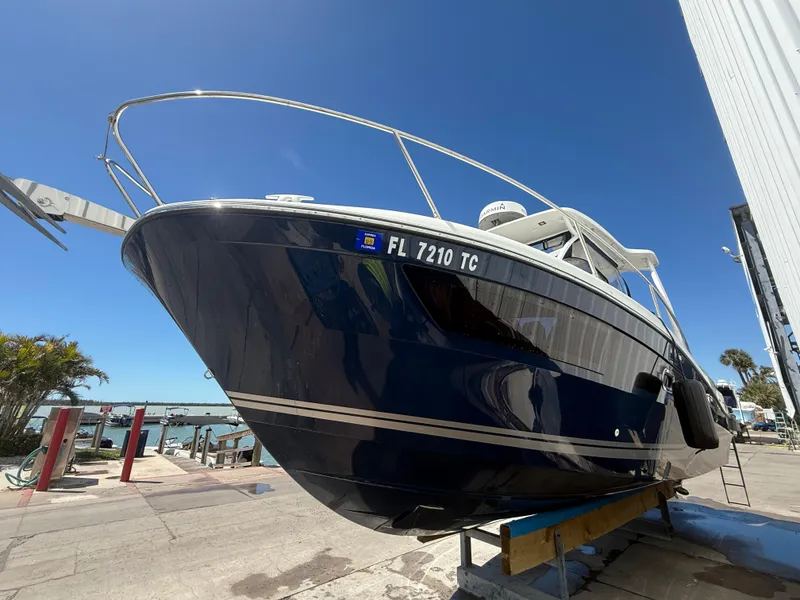 Slide: The Image of 2020 Jeanneau Leader 9.0 WA boat on dry dock under clear blue sky. - 20