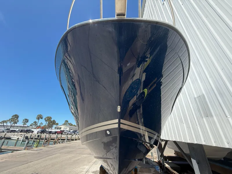 Slide: The Image of 2020 Jeanneau Leader 9.0 WA boat docked, front view, clear blue sky. - 21