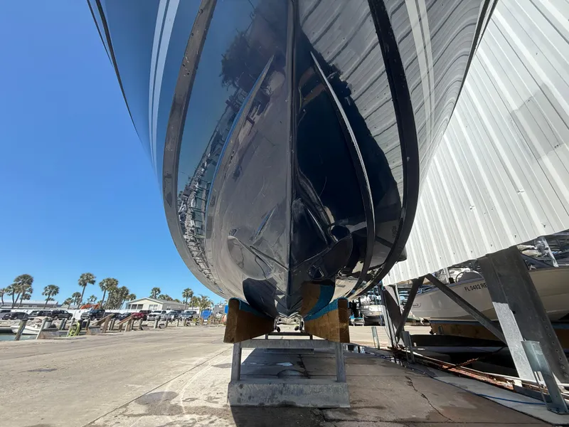 Slide: The Image of 2020 Jeanneau Leader 9.0 WA boat on dry dock, marina background, clear sky. - 22