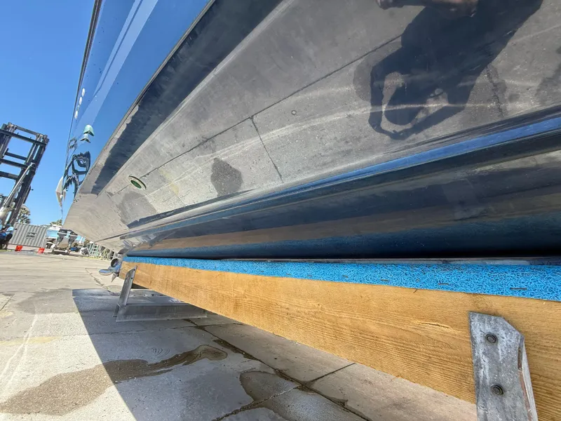 Slide: The Image of 2020 Jeanneau Leader 9.0 WA boat hull on dry dock, side view. - 26