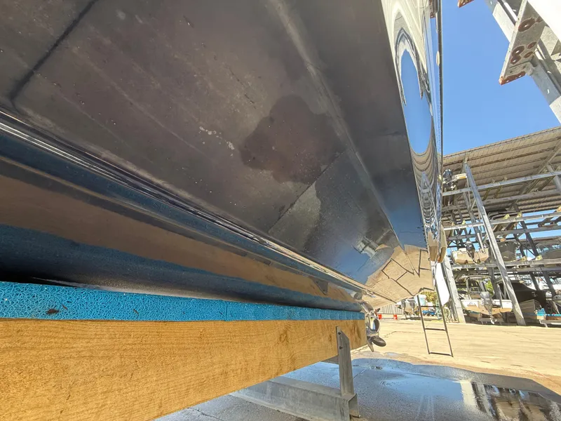 Slide: The Image of 2020 Jeanneau Leader 9.0 WA boat hull on dry dock, side view. - 29