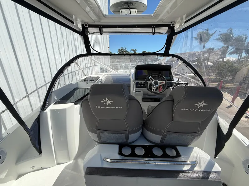 Slide: The Image of 2020 Jeanneau Leader 9.0 WA boat interior with helm and seating area. - 35