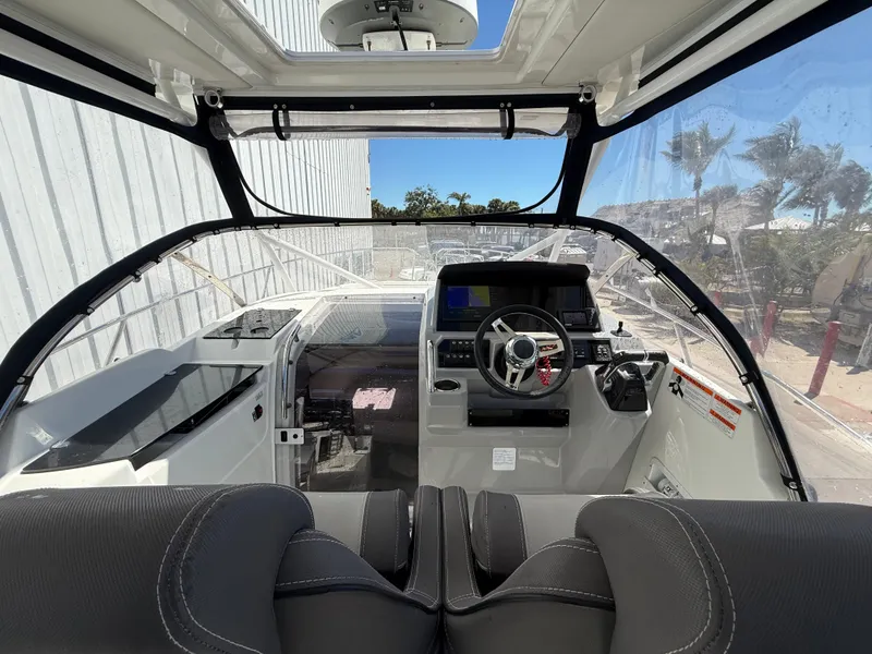 Slide: The Image of 2020 Jeanneau Leader 9.0 WA cockpit with modern controls and seating. - 37