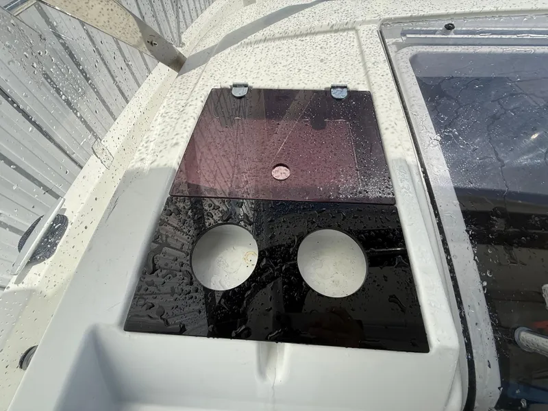 Slide: The Image of 2020 Jeanneau Leader 9.0 WA boat deck with cup holders and wet surface. - 43