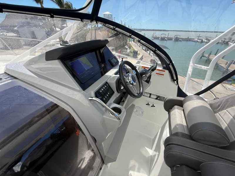 Slide: The Image of Cockpit of 2020 Jeanneau Leader 9.0 WA boat with modern controls and steering wheel. - 45