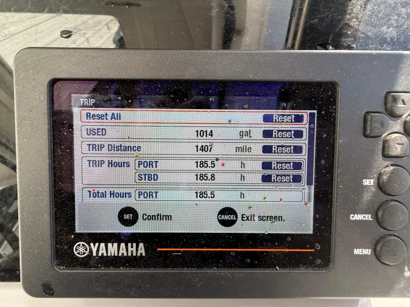 Slide: The Image of Yamaha display showing trip data: 1014 gallons used, 1407 miles traveled, 185.5 hours logged. - 48