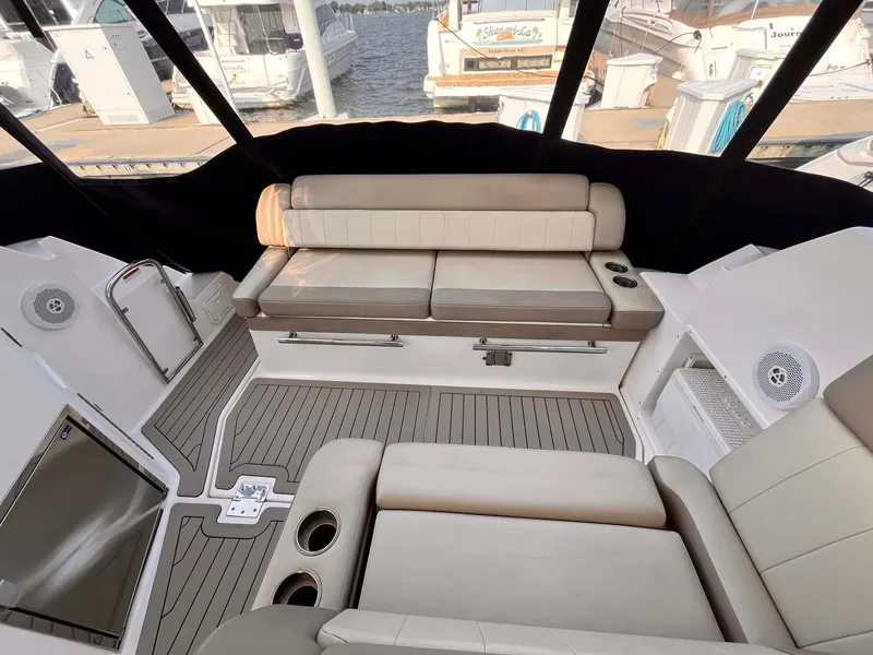 Slide: The Image of Interior of 2014 Regal 35 Sport Coupe with beige seating and wood flooring. - 27